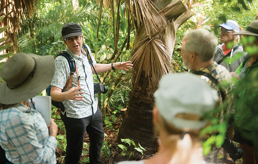 Bill Baker explaining what makes a palm a palm during a botany tour of the Merwin Palm Forest.