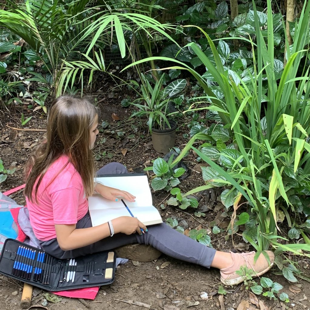 A middle school student at Seabury Hall in the Merwin garden